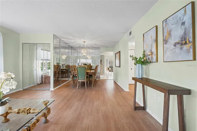 a view of a work space with furniture and wooden floor