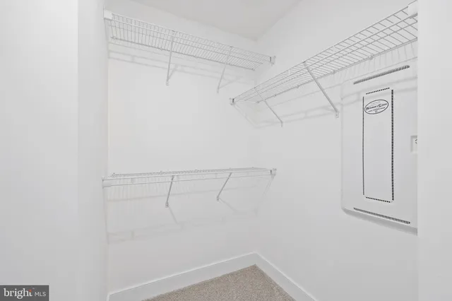 a view of a hallway with washer and dryer