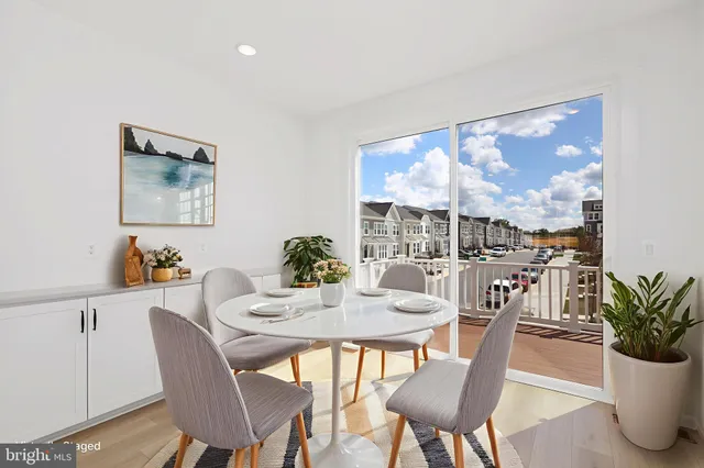 a view of a dining room with furniture window and outside view