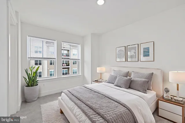 a spacious bedroom with a bed and a couch