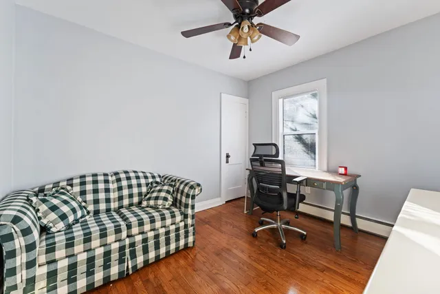 a workspace with furniture and wooden floor