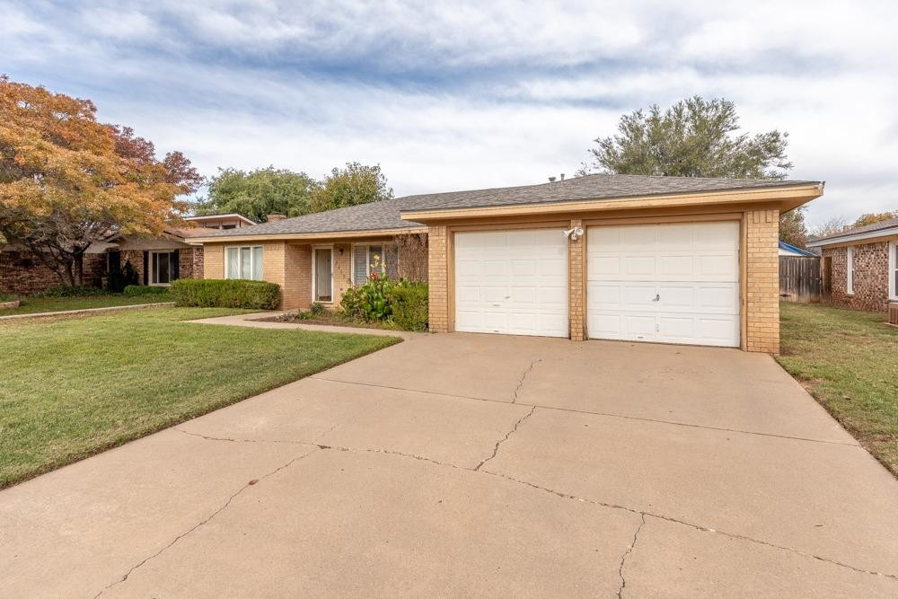 5402 94th Street Lubbock, TX 79424 - Photo 22 of 24 front view of house with a yard