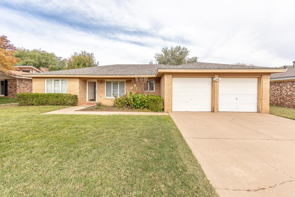 5402 94th Street Lubbock, TX 79424 - Photo 23 of 24 front view of house next to a yard