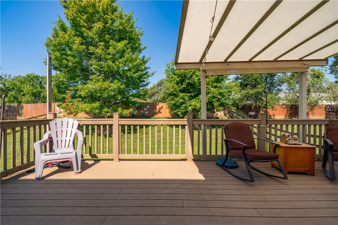 10765 Stone Ridge Way Harrison, OH 45030 - Photo 59 of 68 A spacious wooden deck with a covered area provides an ideal spot for outdoor enjoyment.