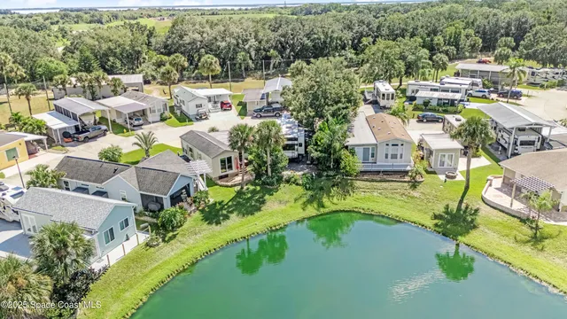 an aerial view of residential house with outdoor space and swimming pool