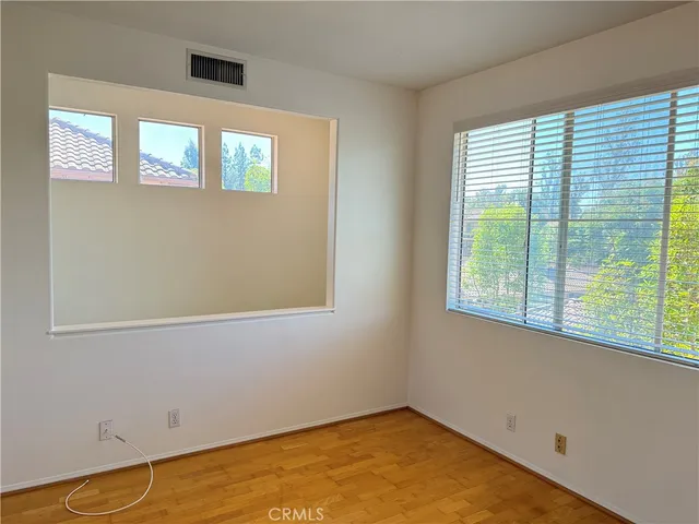 a view of empty room with windows