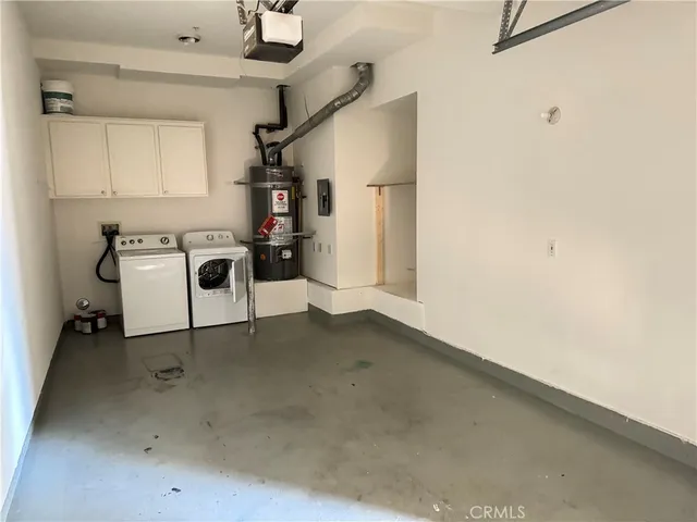 a view of kitchen with furniture and white appliances