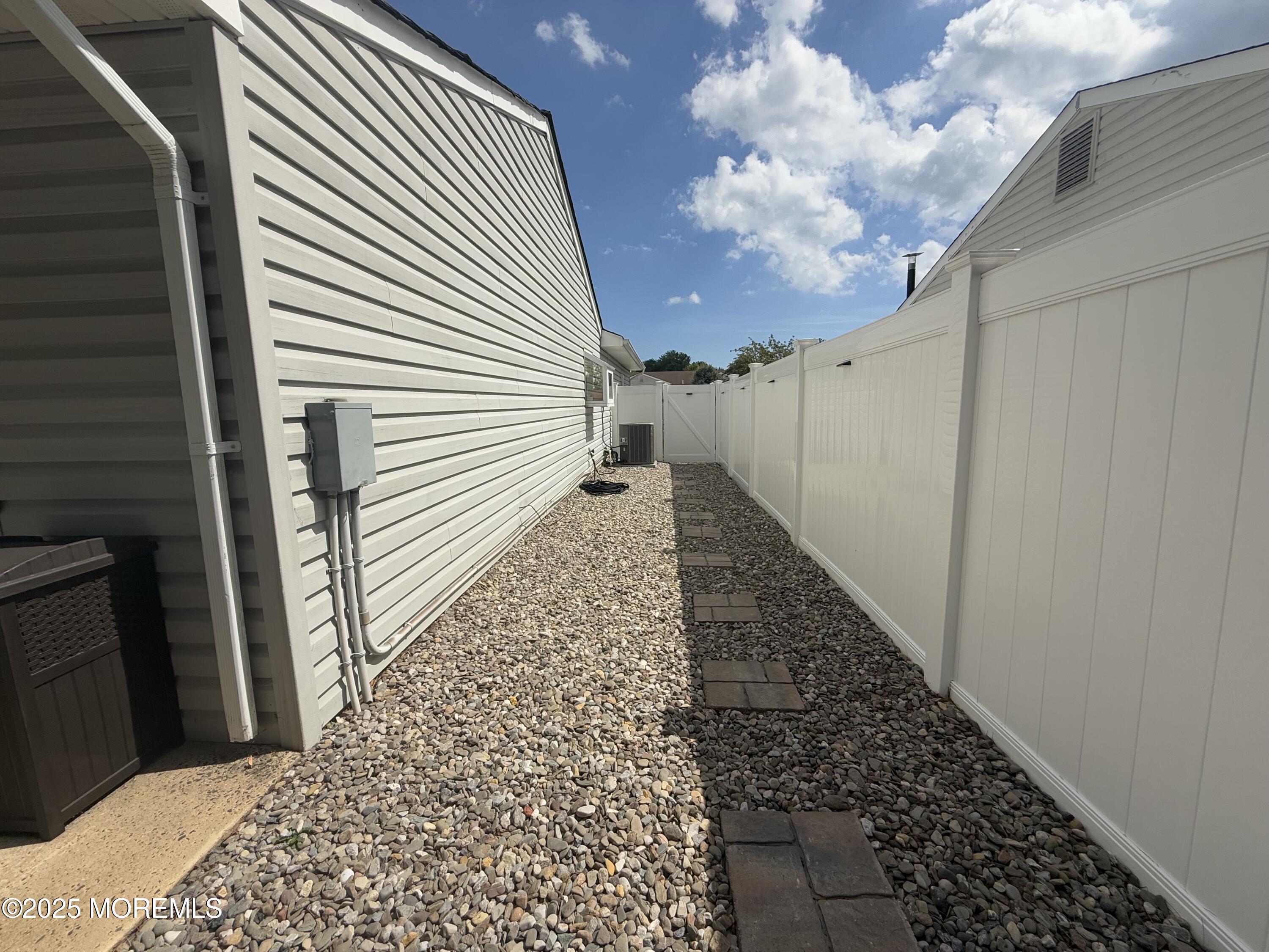 20 Long Road Freehold, NJ 07728 - Photo 19 of 20 a view of a pathway both side of house