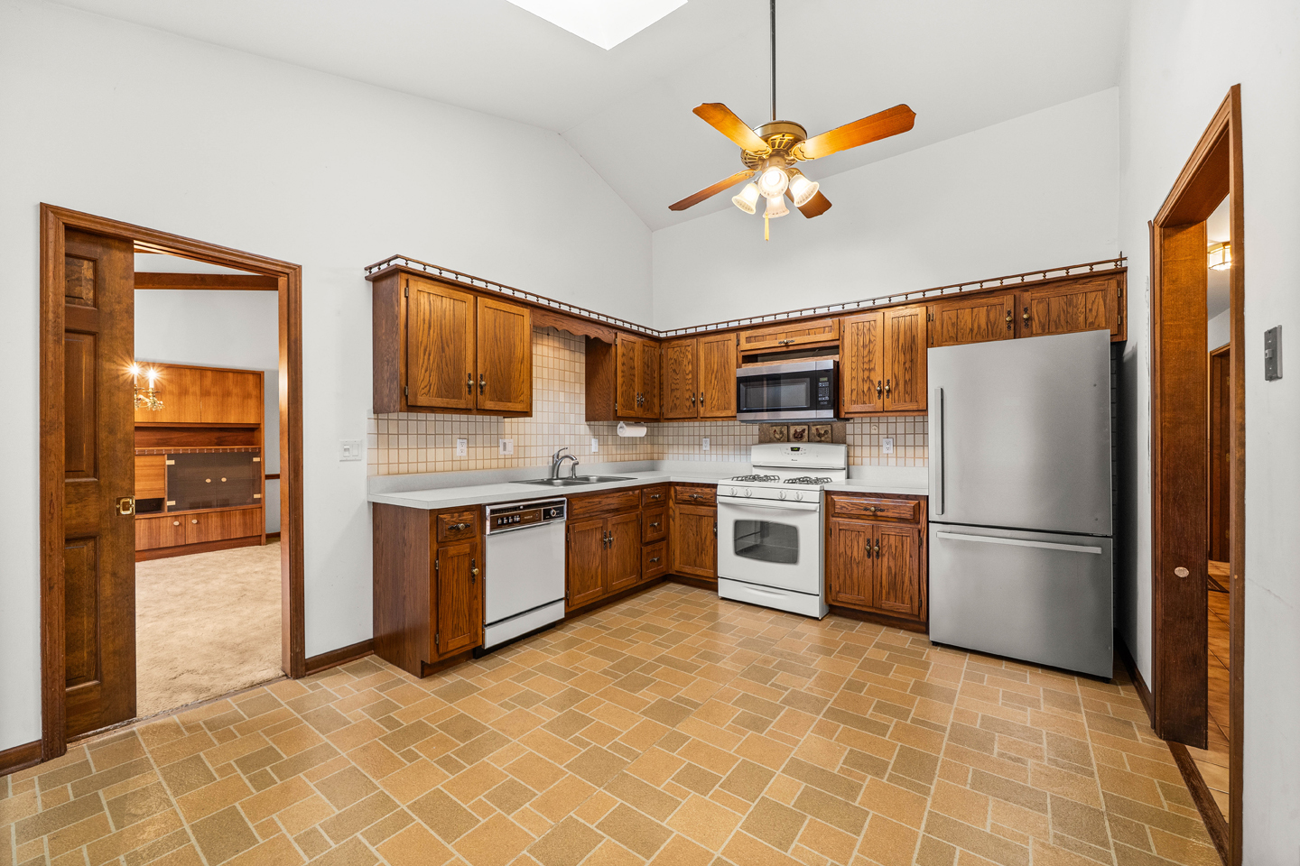 7 Douglas Drive Sugar Grove, IL 60554 - Photo 10 of 38 a kitchen with stainless steel appliances granite countertop a refrigerator a stove and a sink