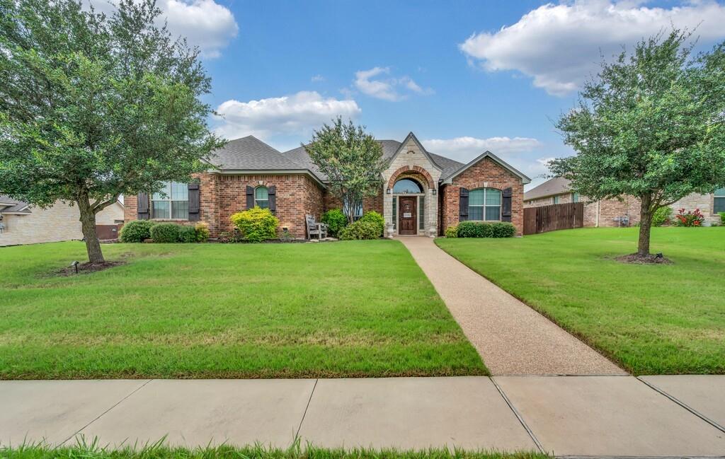 550 Hunton Lane Robinson, TX 76706 - Photo 1 of 35 View of front of home with brick siding and a shingled roof