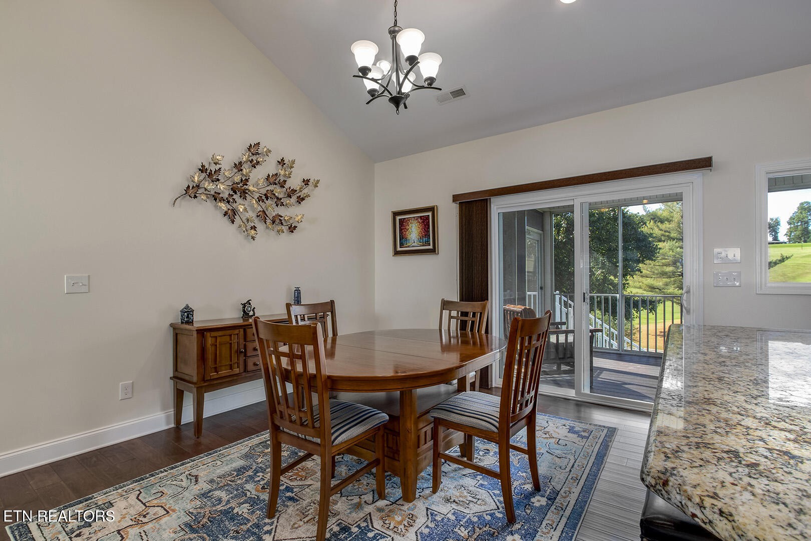 134 Daleyuhski Way Loudon, TN 37774 - Photo 13 of 54 a view of a dining room with furniture a chandelier and wooden floor