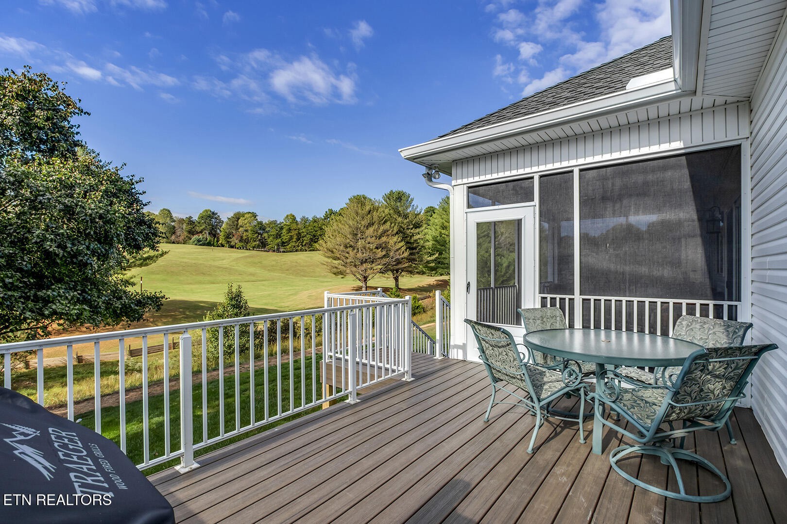 134 Daleyuhski Way Loudon, TN 37774 - Photo 17 of 54 a view of a chair and table on the deck
