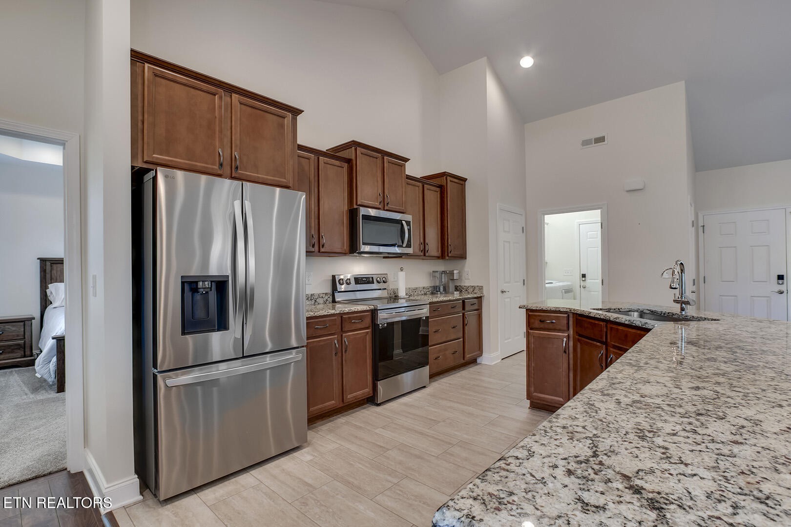 134 Daleyuhski Way Loudon, TN 37774 - Photo 21 of 54 a large kitchen with stainless steel appliances granite countertop a refrigerator stove and oven
