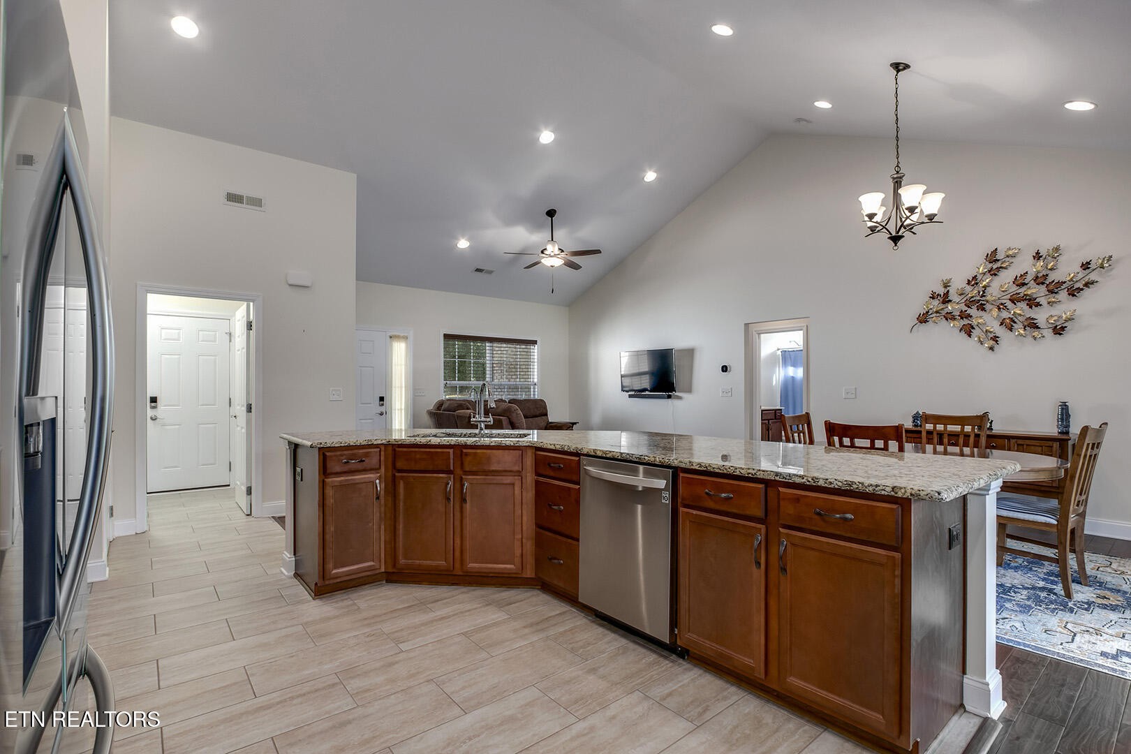 134 Daleyuhski Way Loudon, TN 37774 - Photo 22 of 54 a large kitchen with stainless steel appliances granite countertop a sink and wooden floor