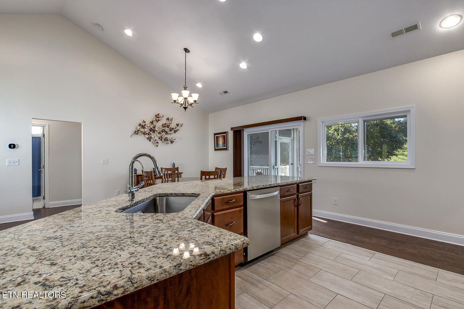 134 Daleyuhski Way Loudon, TN 37774 - Photo 24 of 54 a kitchen with stainless steel appliances granite countertop a sink and a refrigerator