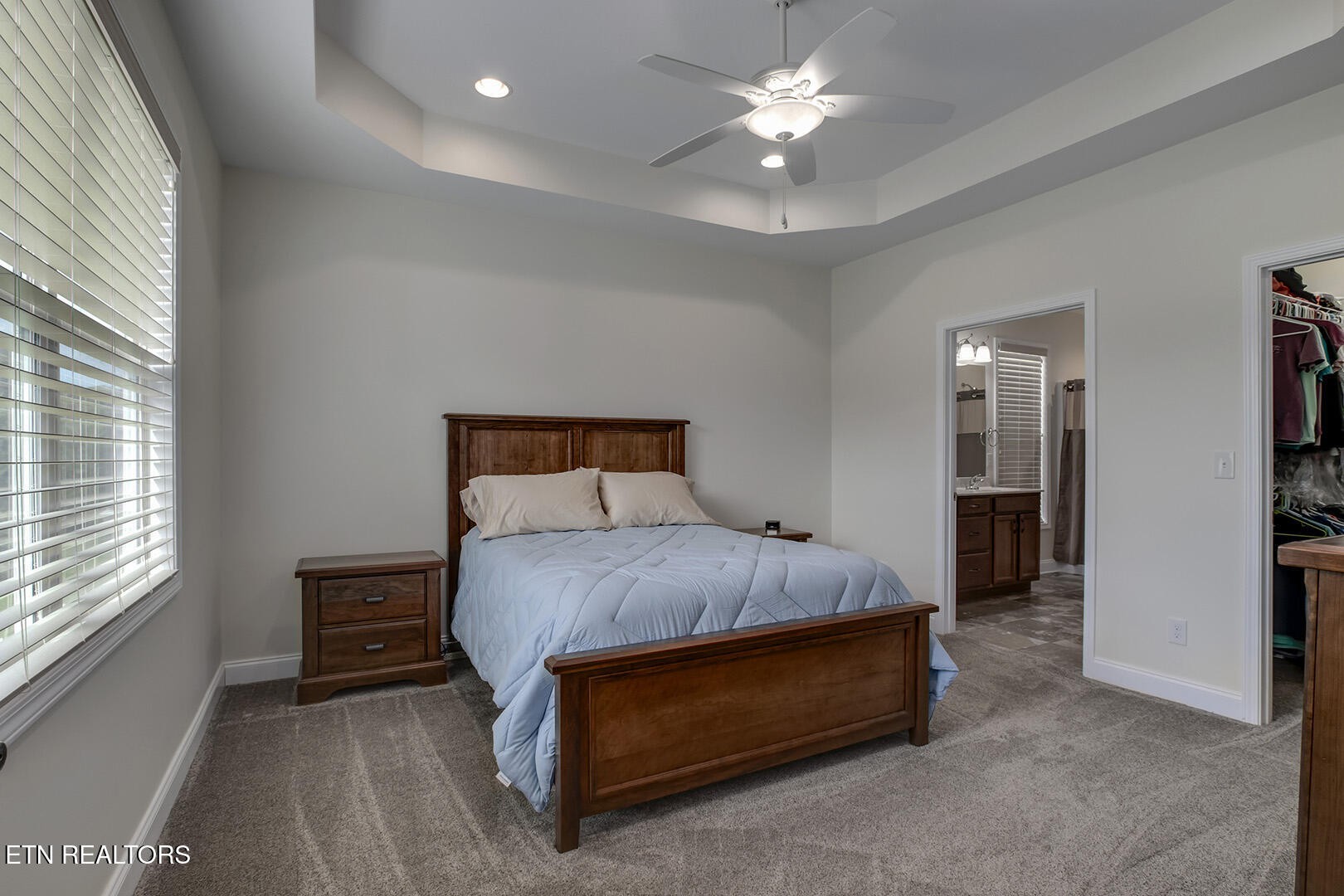 134 Daleyuhski Way Loudon, TN 37774 - Photo 27 of 54 a bedroom with a bed and a ceiling fan