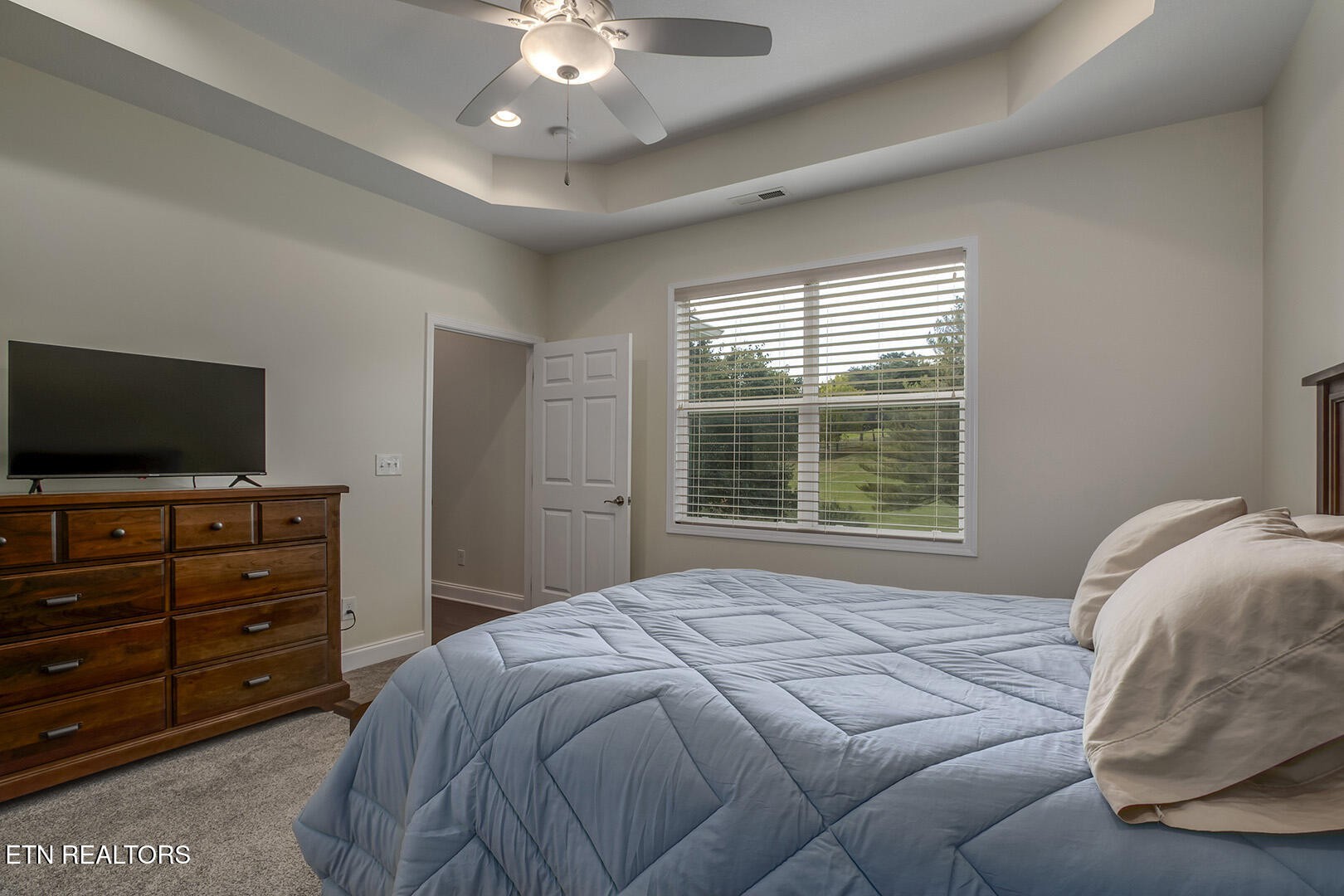 134 Daleyuhski Way Loudon, TN 37774 - Photo 30 of 54 a bedroom with a bed and flat screen tv