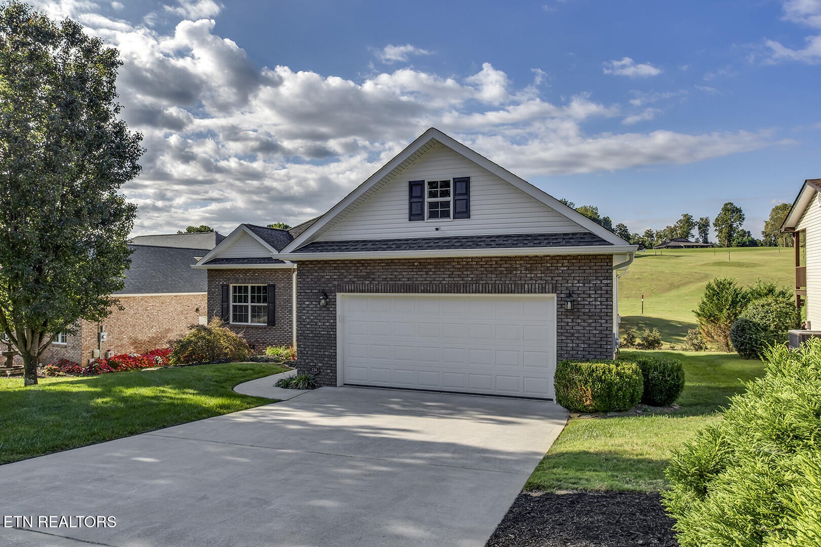 134 Daleyuhski Way Loudon, TN 37774 - Photo 3 of 54 a front view of house with yard and trees in the background