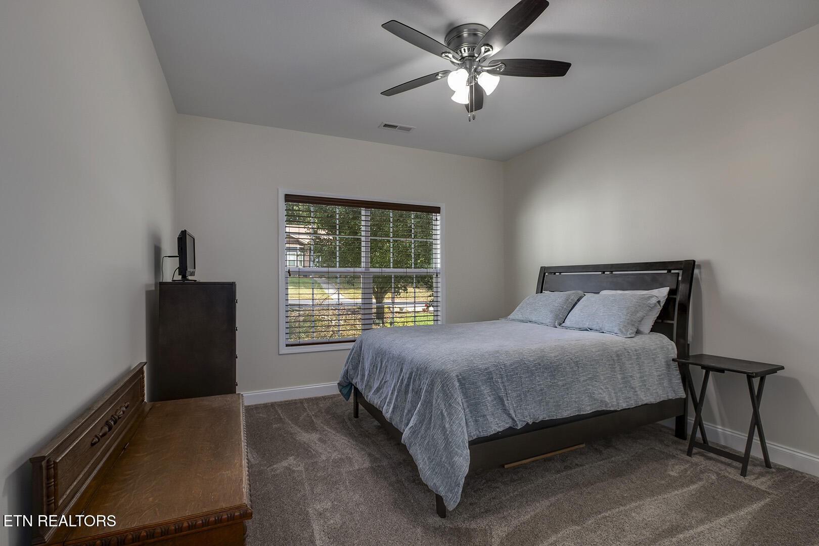 134 Daleyuhski Way Loudon, TN 37774 - Photo 33 of 54 a bedroom with a bed and a chandelier