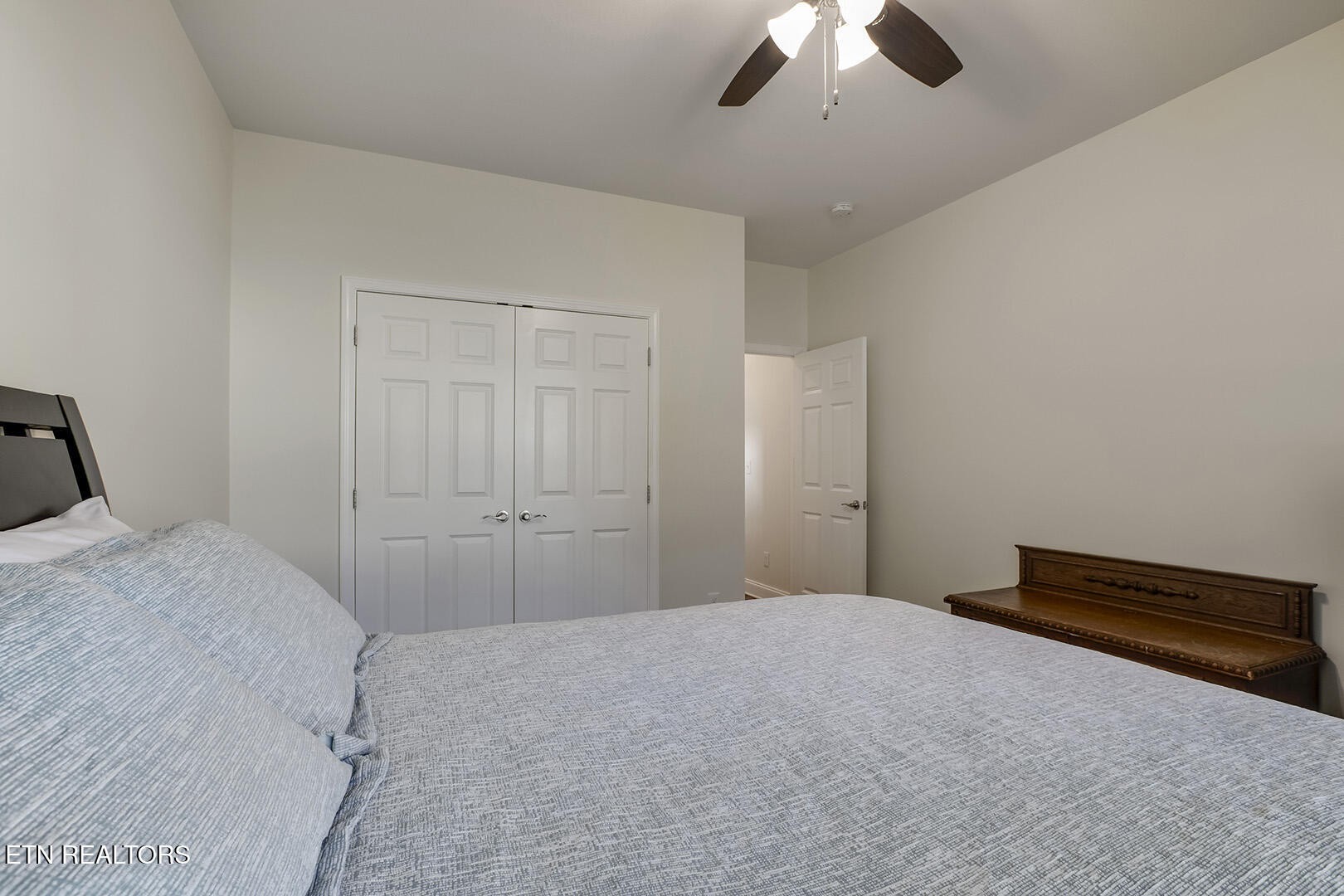 134 Daleyuhski Way Loudon, TN 37774 - Photo 34 of 54 a bedroom with a bed and a ceiling fan