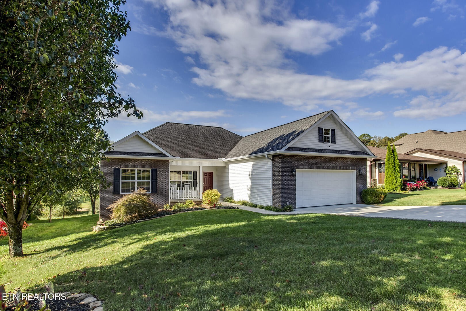 134 Daleyuhski Way Loudon, TN 37774 - Photo 4 of 54 a front view of a house with a yard and trees