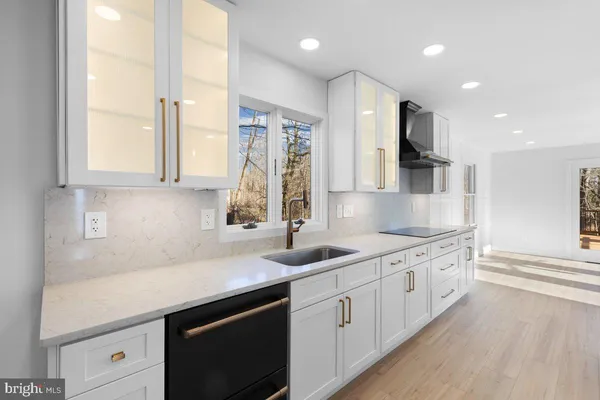 a kitchen with stainless steel appliances a refrigerator and a sink