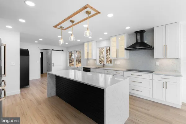 a view of a kitchen with washer and dryer