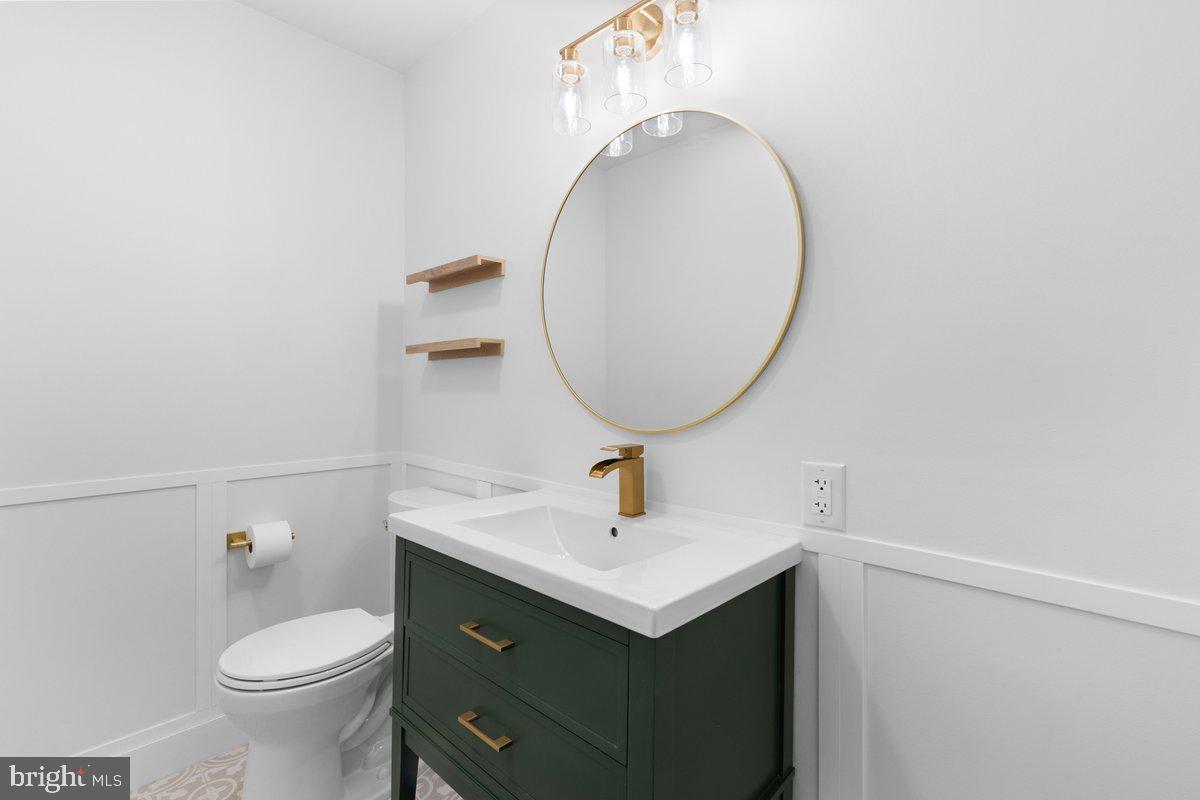 144 Van Dyke Road Hopewell, NJ 08525 - Photo 16 of 59 a bathroom with a sink toilet and a mirror