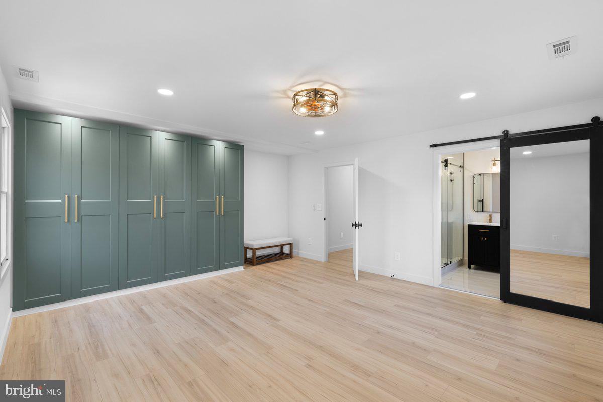 144 Van Dyke Road Hopewell, NJ 08525 - Photo 27 of 59 a view of an empty room with wooden floor