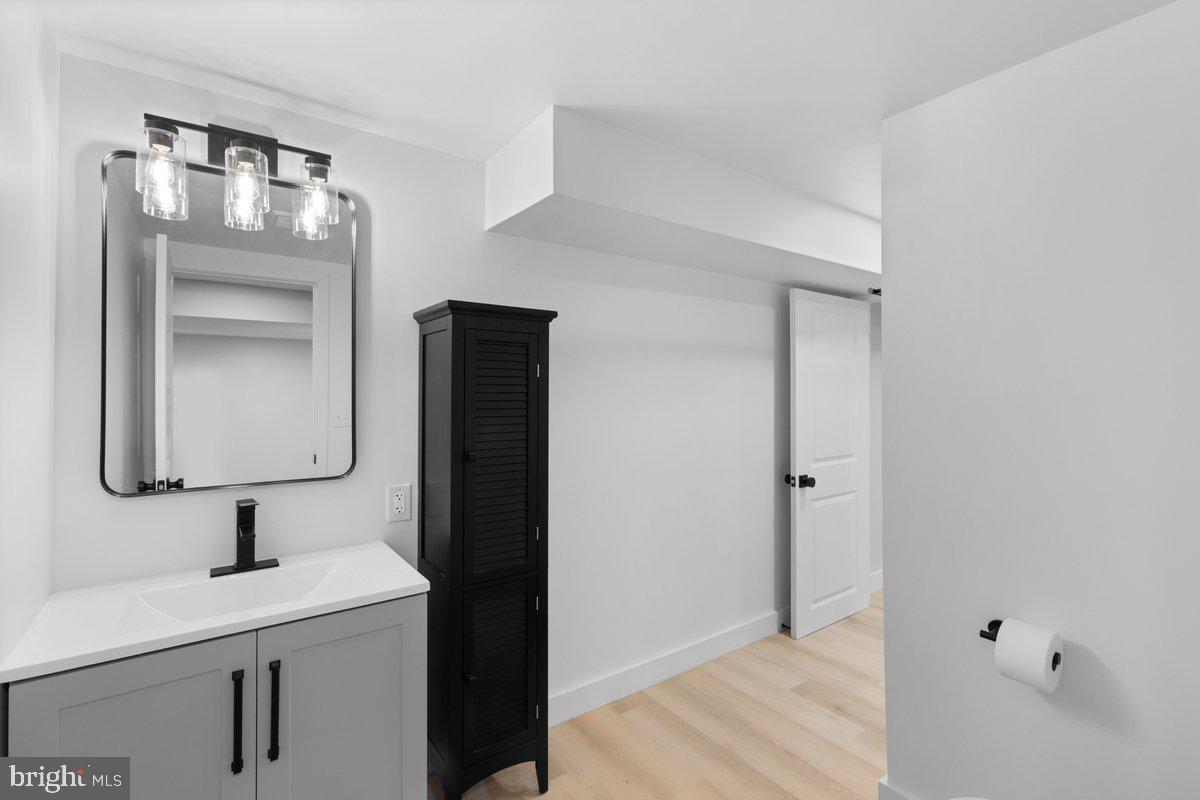 144 Van Dyke Road Hopewell, NJ 08525 - Photo 36 of 59 a bathroom with a sink and mirror