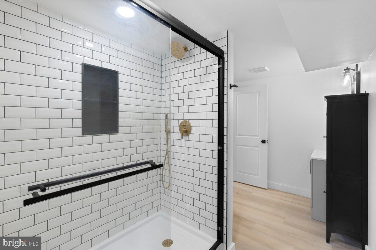 144 Van Dyke Road Hopewell, NJ 08525 - Photo 37 of 59 a bathroom with a shower and a sink