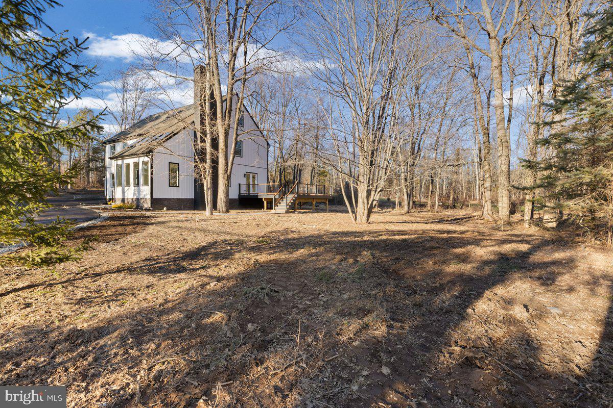 144 Van Dyke Road Hopewell, NJ 08525 - Photo 57 of 59 a front view of a building with large trees