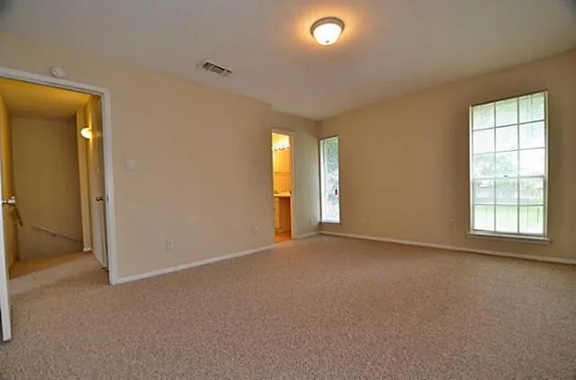 a bathroom with a toilet and bathtub