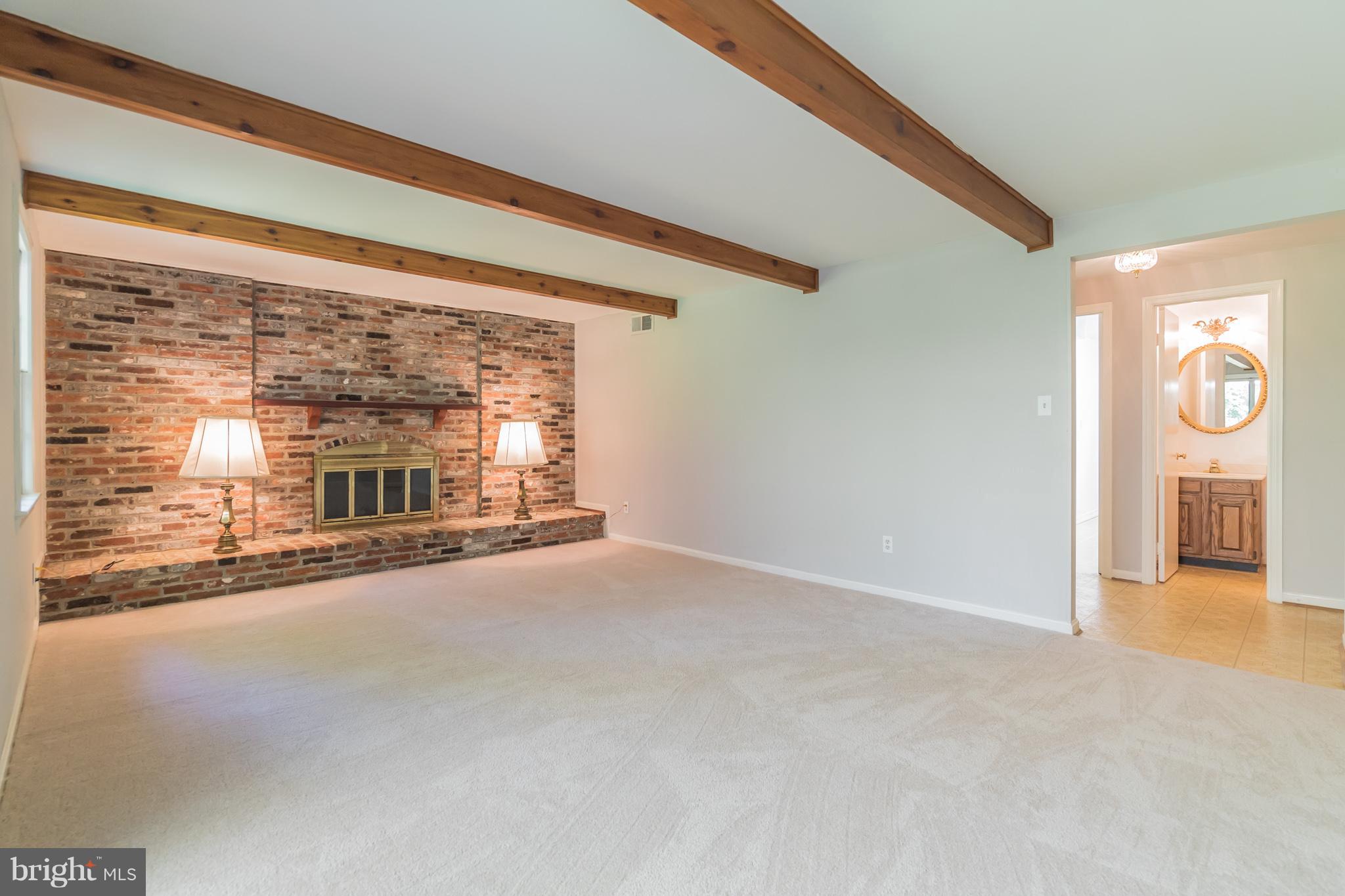 8300 Aqueduct Road Potomac, MD 20854 - Photo 12 of 30 Family Room with Brick Fireplace