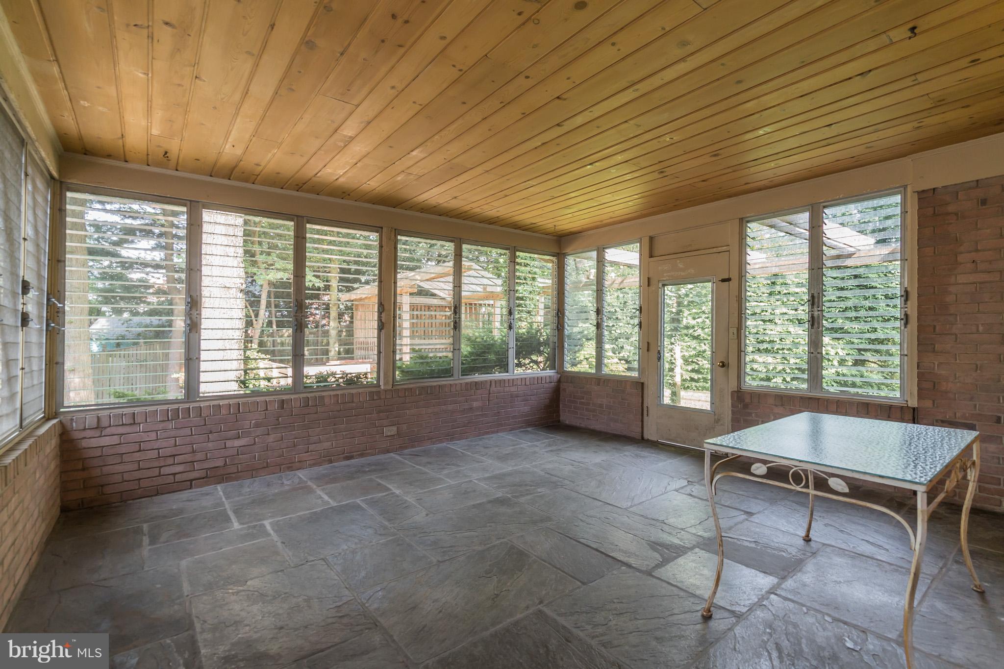 8300 Aqueduct Road Potomac, MD 20854 - Photo 26 of 30 Glass-Enclosed Rear Patio off Kitchen