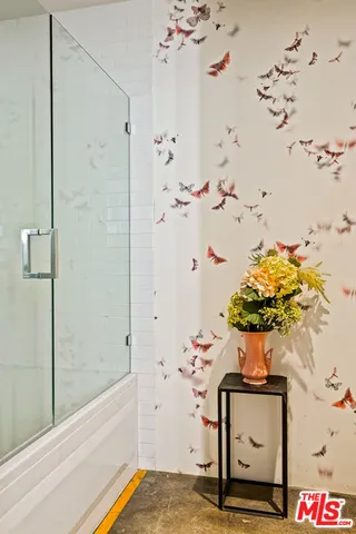 a white toilet sitting next to a bathroom sink