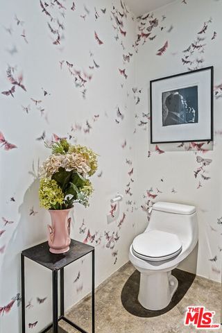 a kitchen with stainless steel appliances granite countertop a stove and cabinets
