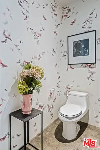 a kitchen with stainless steel appliances granite countertop a stove and cabinets