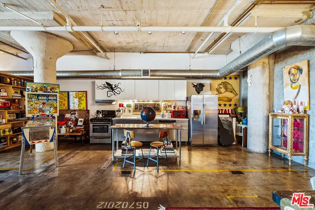 a living room filled with furniture and a chandelier