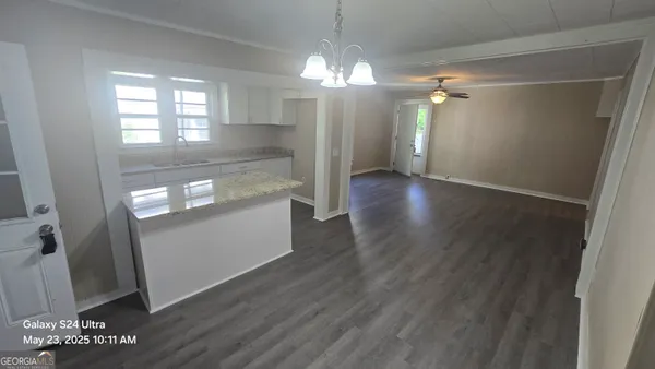 wooden floor in an empty room with a mirror