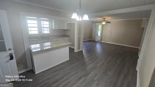 wooden floor in an empty room with a mirror
