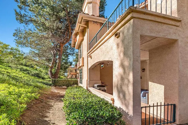 a tennis court with view of palm trees