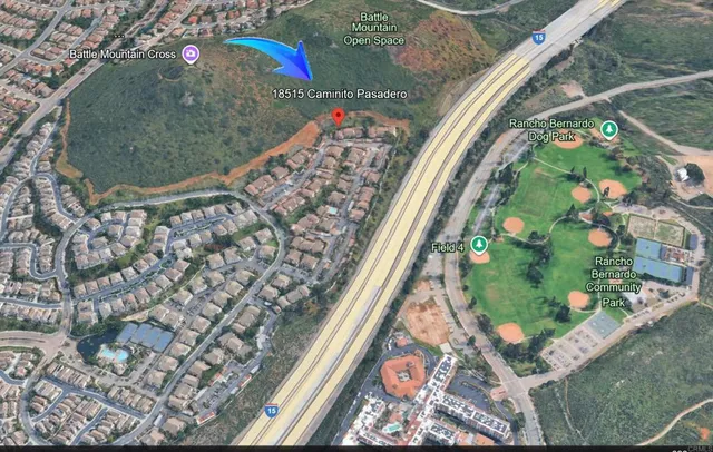 a view of a lake with a house in the background