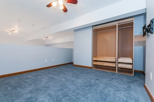 an empty room with ceiling fan