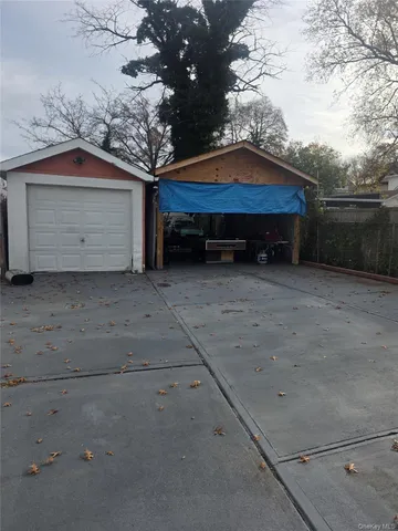 a backyard of house with wooden fence