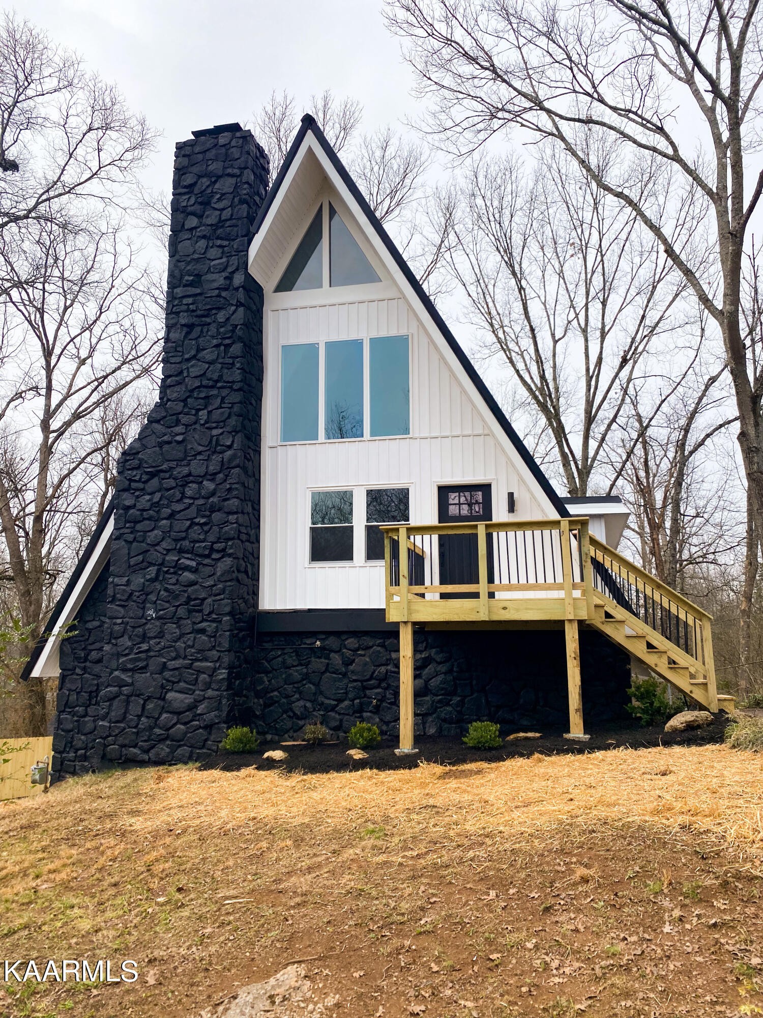 232 East Red Bud Road Knoxville, TN 37920 - Photo 1 of 34 a front view of a house with a yard covered with snow