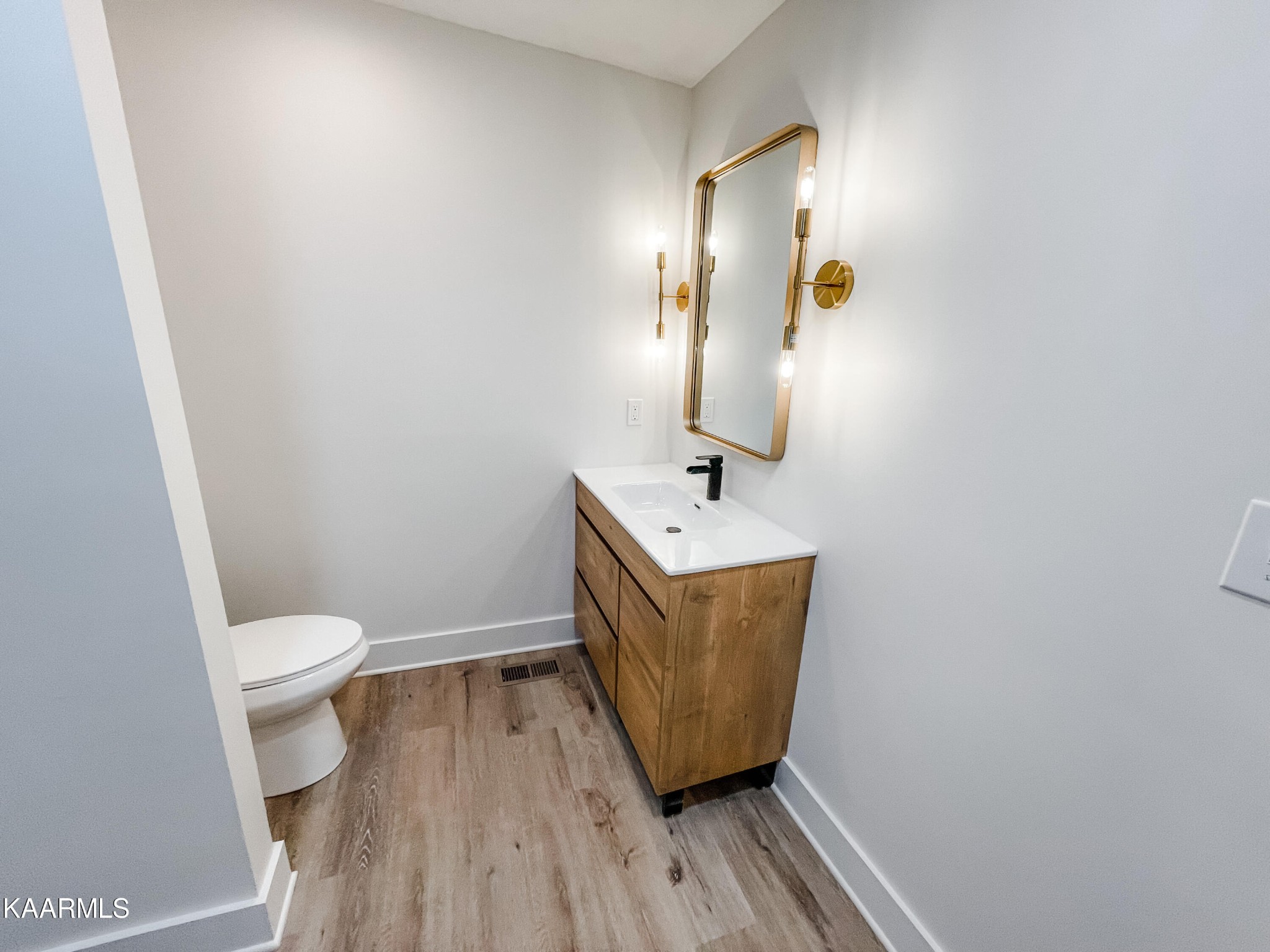232 East Red Bud Road Knoxville, TN 37920 - Photo 11 of 34 a bathroom with a sink a toilet and mirror