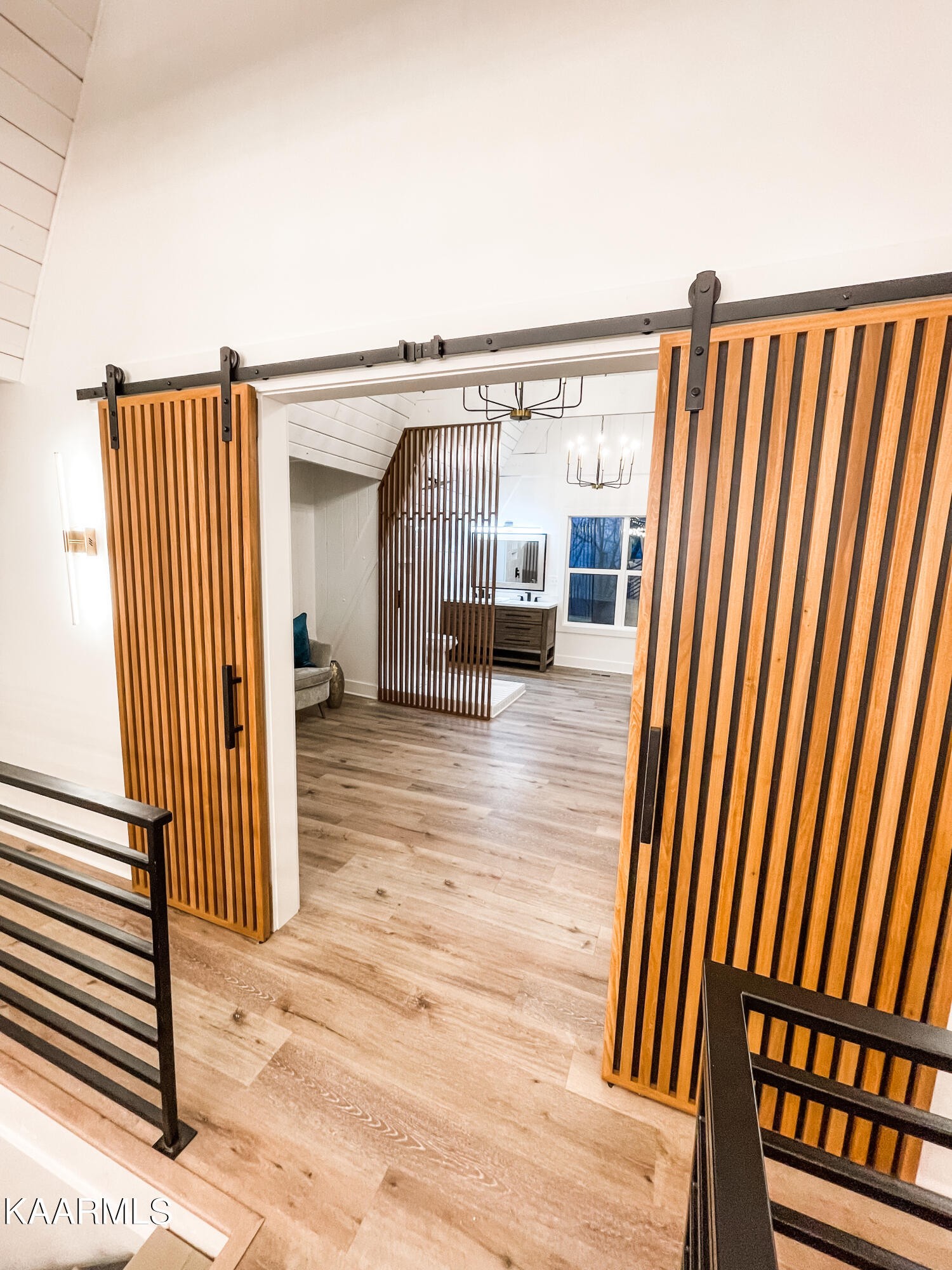 232 East Red Bud Road Knoxville, TN 37920 - Photo 17 of 34 a view of a living room and staircase with wooden floor