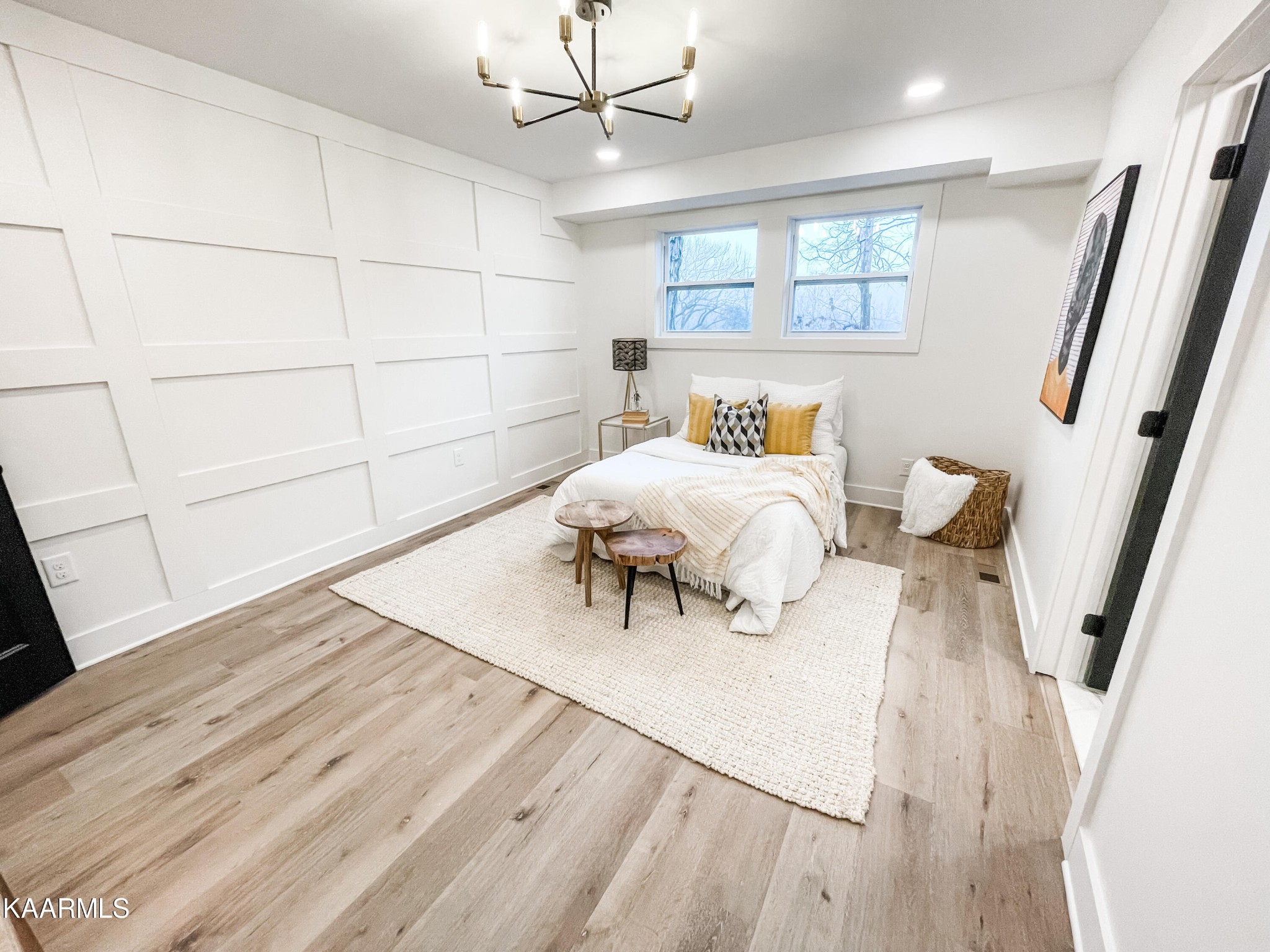 232 East Red Bud Road Knoxville, TN 37920 - Photo 19 of 34 a bedroom with a bed and a dresser with wooden floor