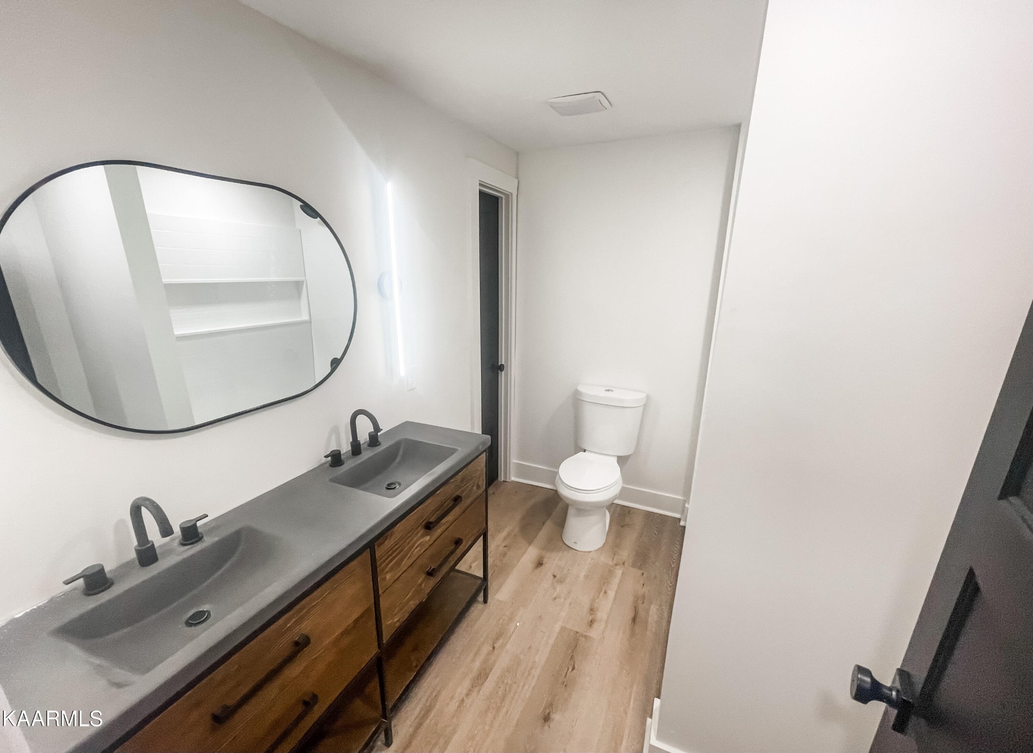 232 East Red Bud Road Knoxville, TN 37920 - Photo 32 of 34 a bathroom with a granite countertop sink and a mirror